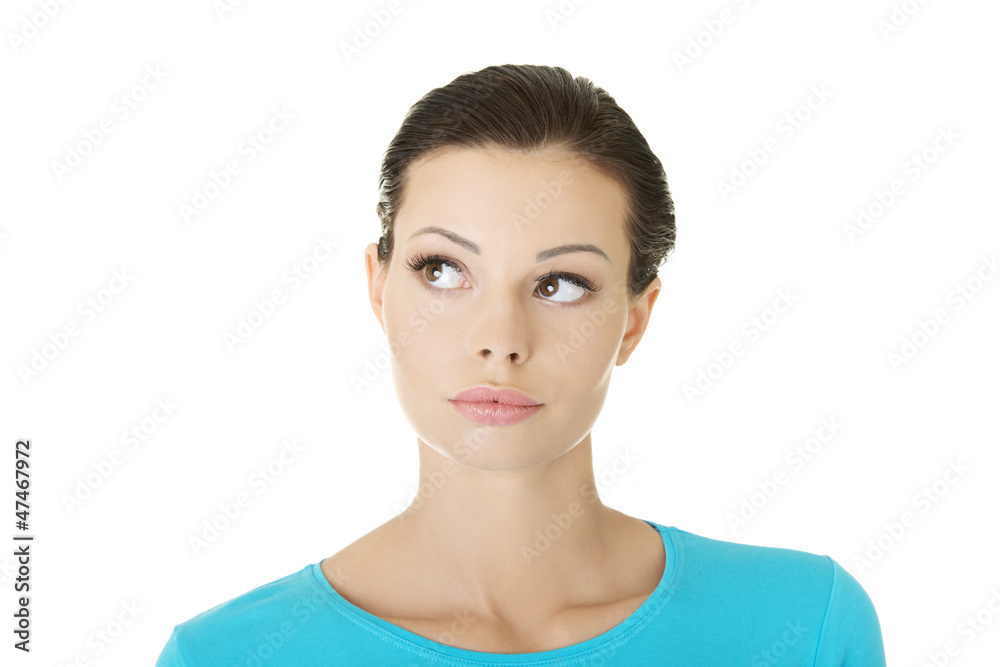 Thoughtful female student looking up Thoughtful female student looking up