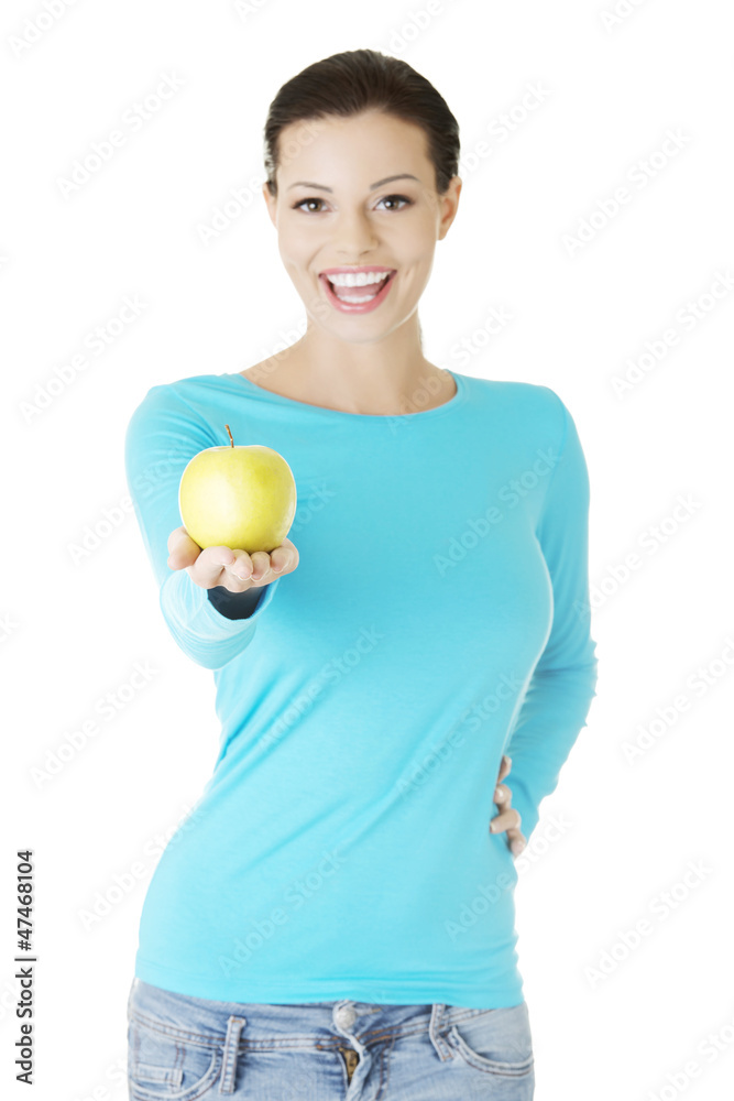 Young woman holding green fresh apple Young woman holding green fresh apple