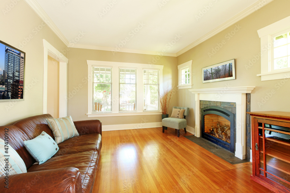Fototapeta premium Elegant living room with fireplace and leather sofa
