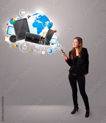 young woman standing and browsing on her phone photo