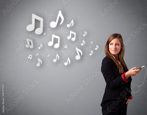 Pretty young woman singing and listening to music with musical n