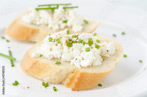 baguette with cottage cheese and green onions
