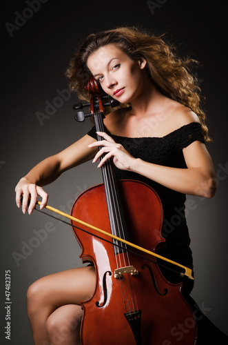 Woman performer with cello  in studio