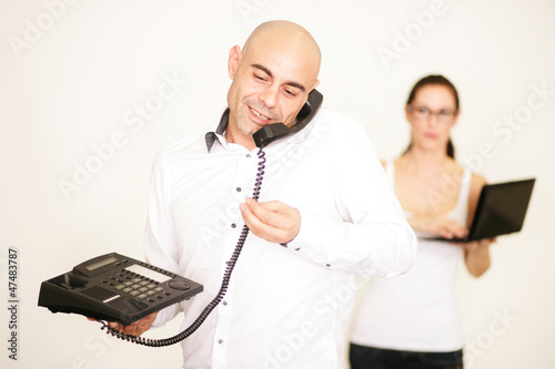 Geschäftsführer am Telefon photo