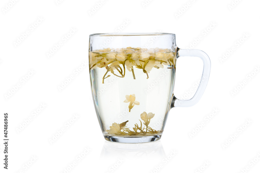Hot jasmine tea with flowers isolated on white background Hot jasmine tea with flowers isolated on white background