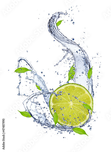 Lime falling in water splash, isolated on white background