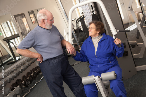 Senior Adult Couple Working...