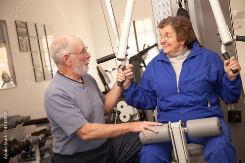 Senior Adult Couple Working...
