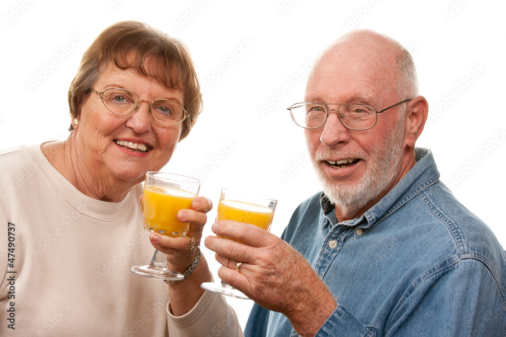 Happy Senior Couple with Glasses of Orange Juice Happy Senior Couple with Glasses of Orange Juice