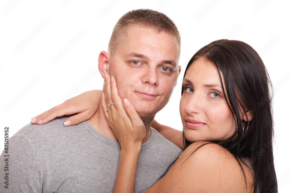 Portrait of a beautiful young happy smiling couple isolated