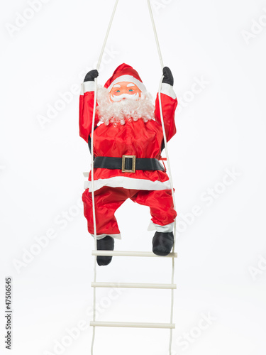 toy santa climbing a ladder