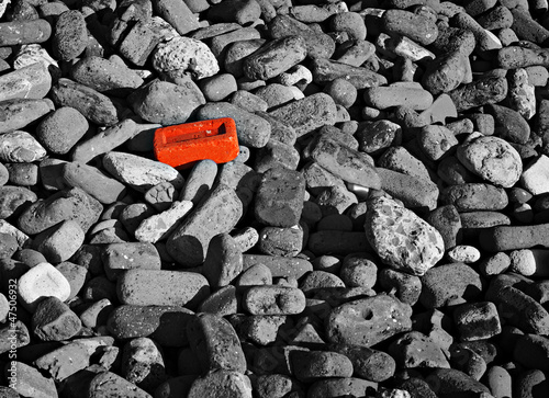 Картината върху платно Single red brick amongst lots of monochrome bricks