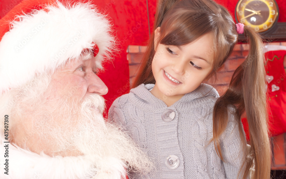 happy little girl and santa claus happy little girl and santa claus