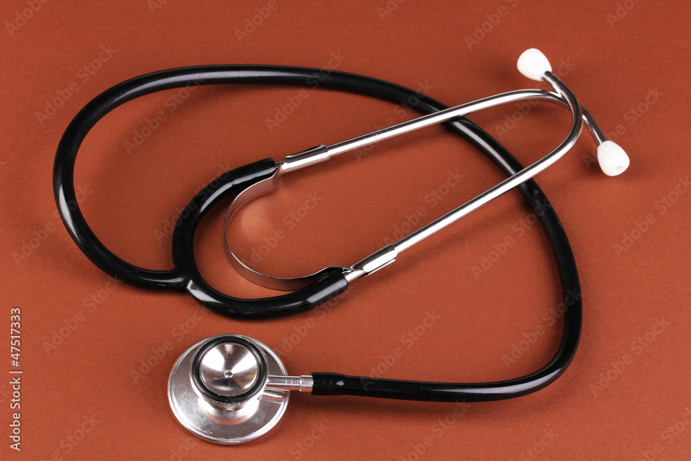 Stethoscope on brown background Stethoscope on brown background