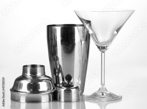 Cocktail shaker and cocktail glass isolated on white