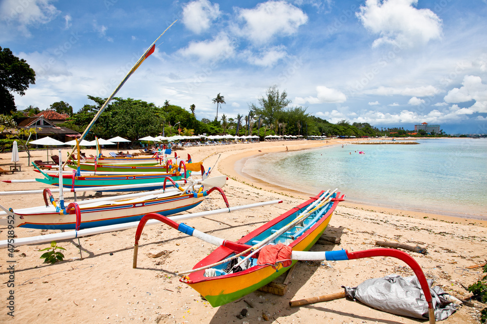Traditional fishing boats on a beach in Sanur on Bali Traditional fishing boats on a beach in Sanur on Bali