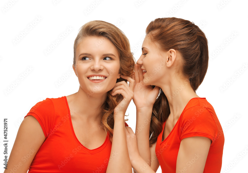 two talking teenage girls in red t-shirts two talking teenage girls in red t-shirts