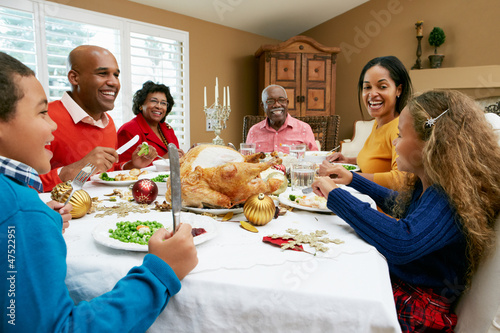 Multi Generation Family Celebrating With Christmas Meal photo