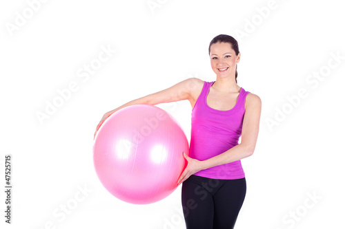 healthy young woman exercising with fit-ball in gym