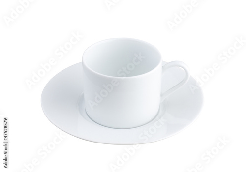 An empty white porcelain tea or coffee cup with causer