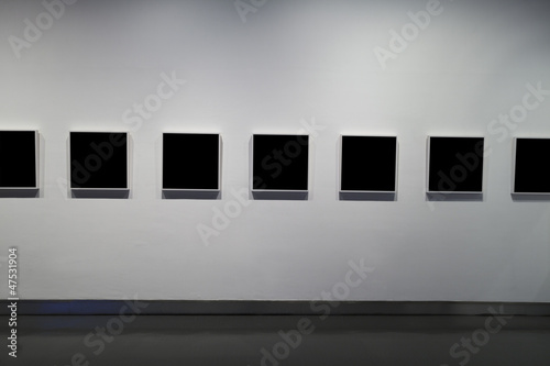 empty frames in museum photo