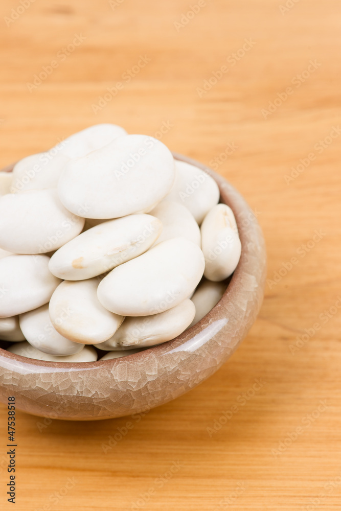 large lima beans in bowl on table large lima beans in bowl on table
