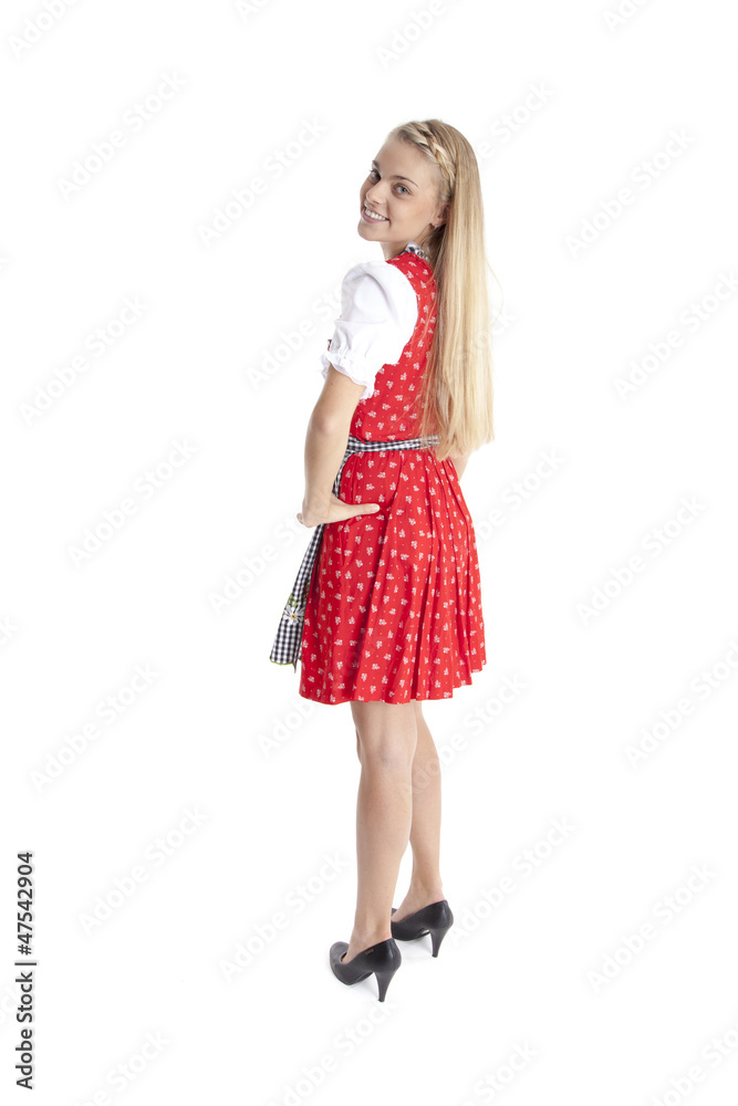 Blonde Frau in Tracht schaut über ihre Schulter Blonde Frau in Tracht schaut über ihre Schulter