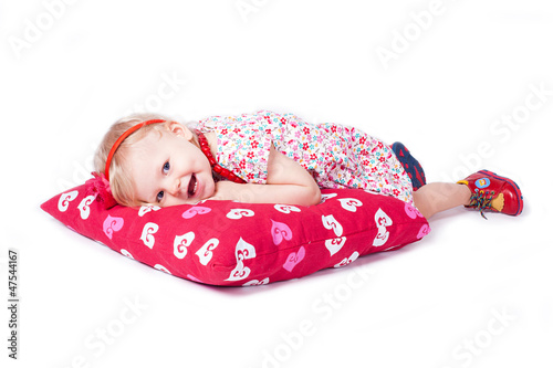 Lovely baby play with a large pillow, Stodio photo