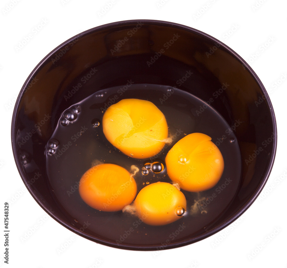 chicken broken egg in black ceramic bowl chicken broken egg in black ceramic bowl