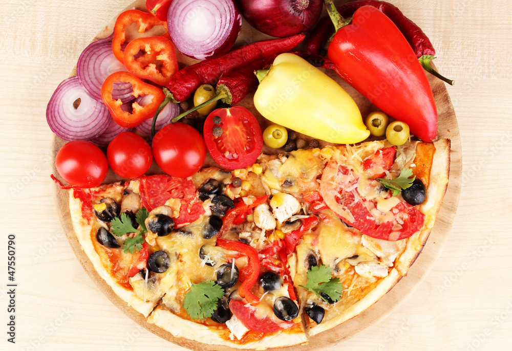 Delicious pizza with ingredients close-up Delicious pizza with ingredients close-up