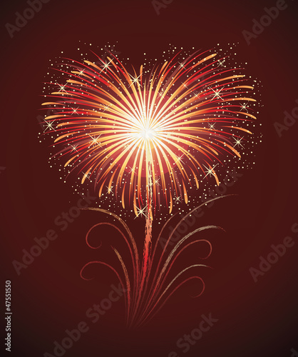 Firework in a shape of heart on the red background.