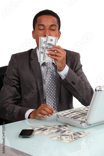 Canvas Print A con man smelling his loot