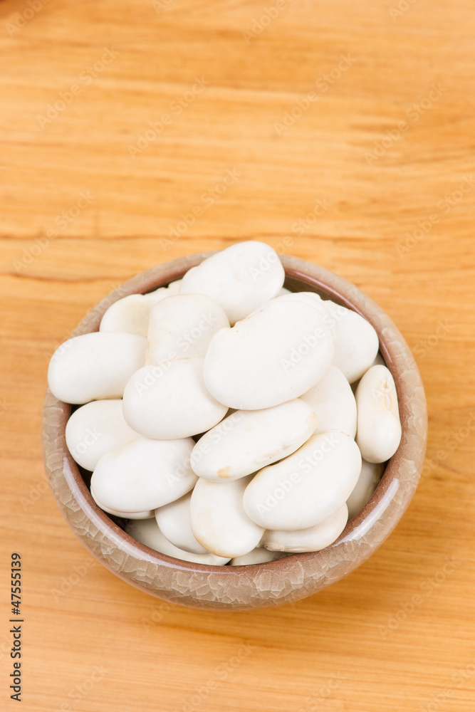 large lima beans in bowl on table large lima beans in bowl on table