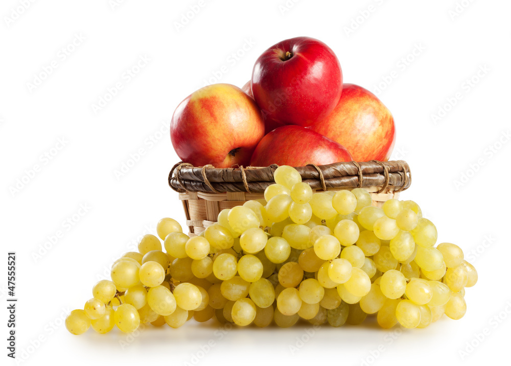 Grapes and apples in a basket isolated on white background Grapes and apples in a basket isolated on white background