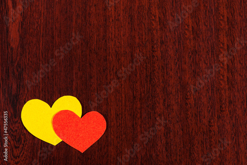 two hearts on wooden background