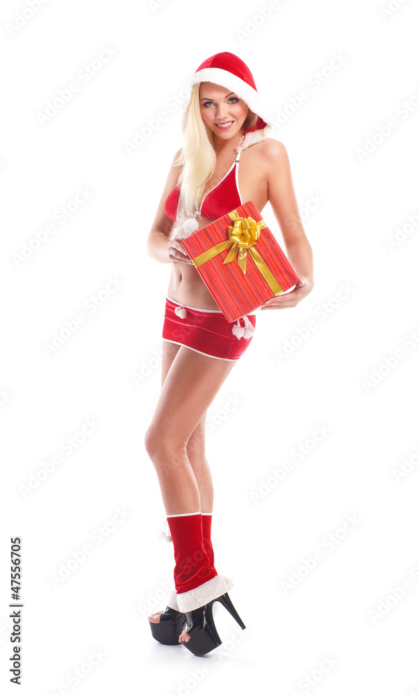 A young woman in erotic Christmas clothes holding a present A young woman in erotic Christmas clothes holding a present