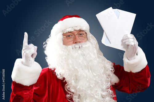 santa claus reading a letter photo