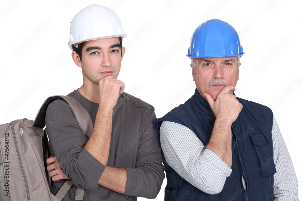 young apprentice and older instructor looking puzzled young apprentice and older instructor looking puzzled