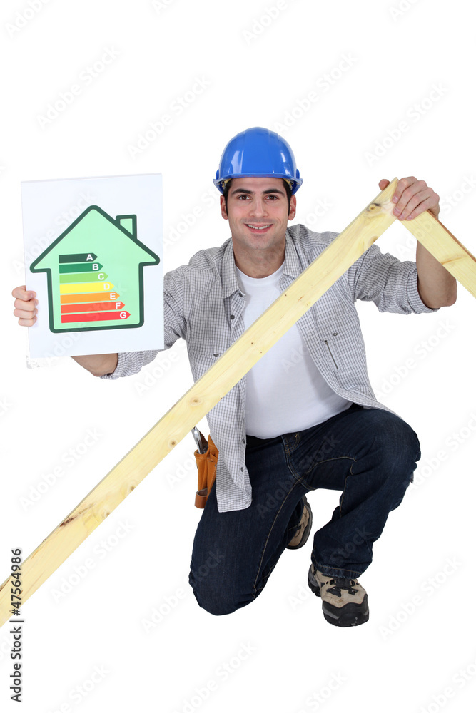 Tradesman holding a frame and an energy efficiency rating chart Tradesman holding a frame and an energy efficiency rating chart