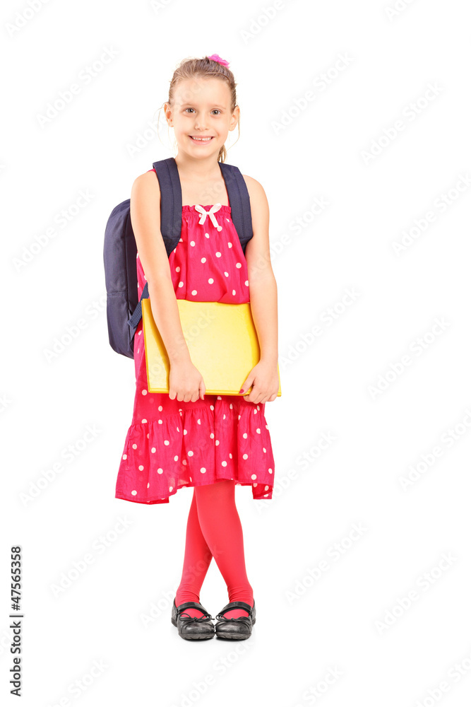 Full length portrait of a smiling schoolgirl holding a notebook Full length portrait of a smiling schoolgirl holding a notebook