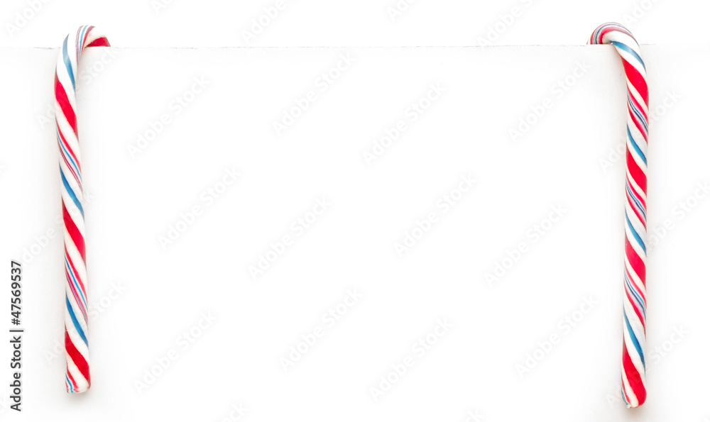 Fototapeta premium Two candy canes isolated on white background. Christmas, holiday