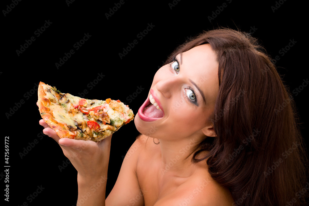 young woman eating a piece of pizza