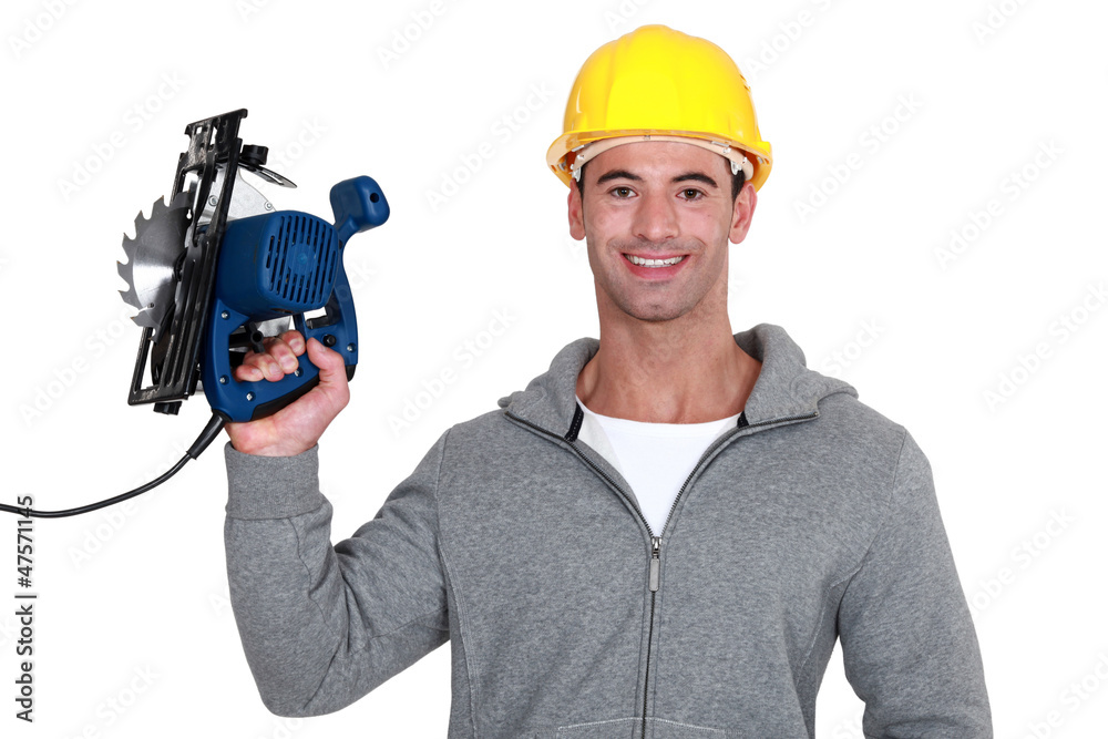 craftsman holding an electric saw craftsman holding an electric saw