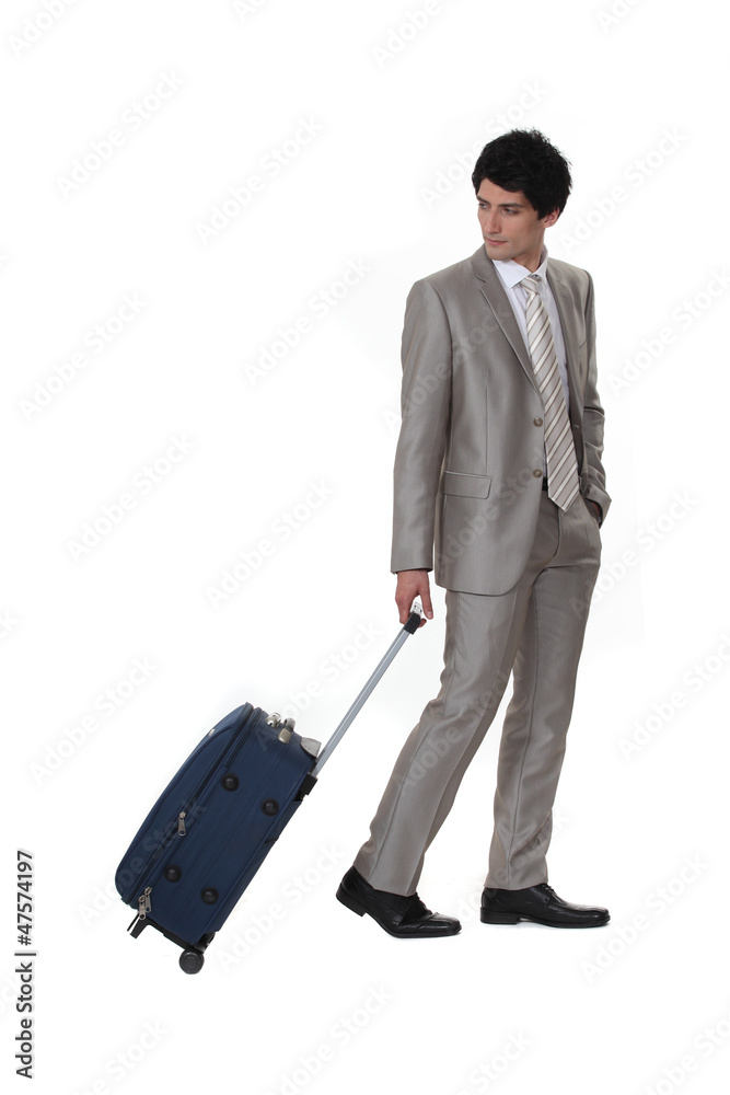 A businessman leaving on a business trip A businessman leaving on a business trip