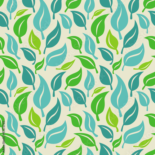 Vector seamless background with green and blue leaves