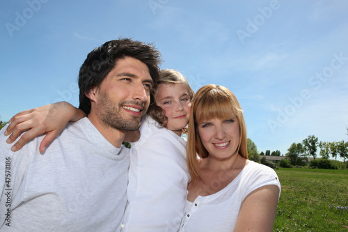 Parents with their daughter in a park