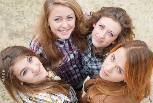 Four happy teen girls friends