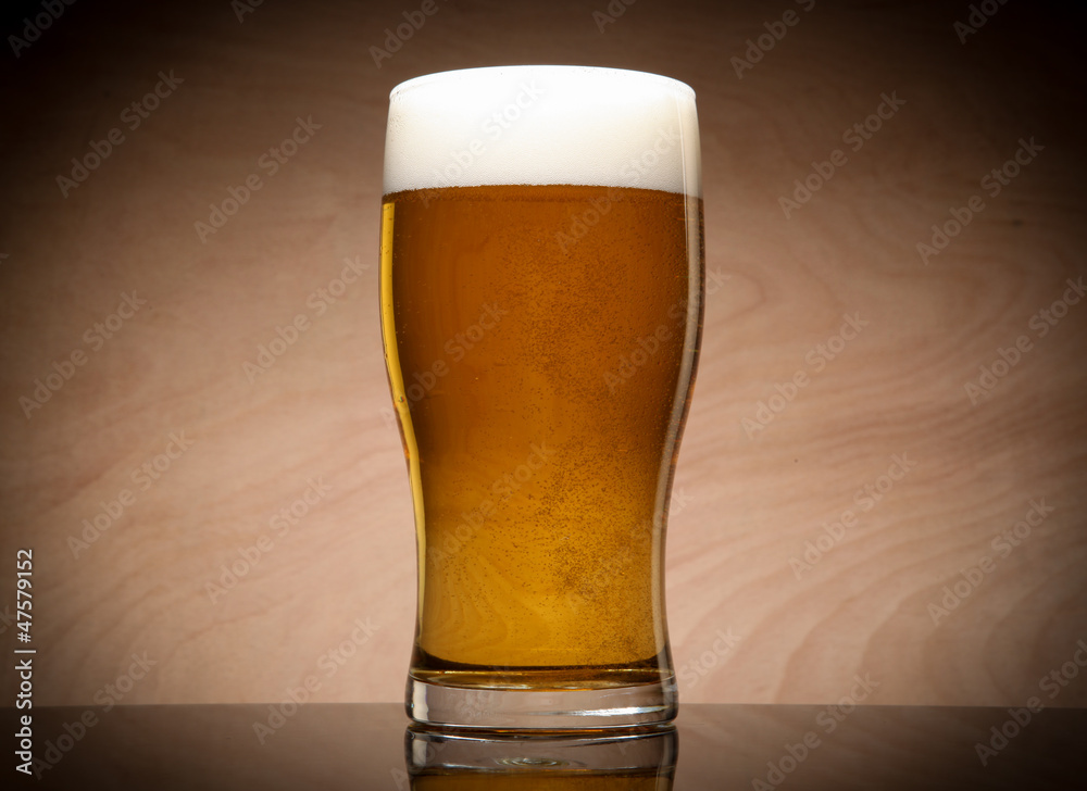 Glass with beer on the table