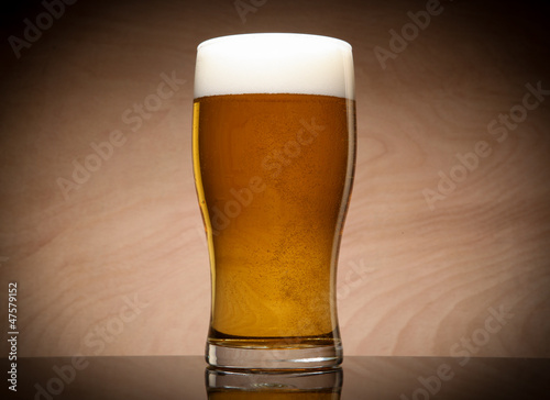 Glass with beer on the table