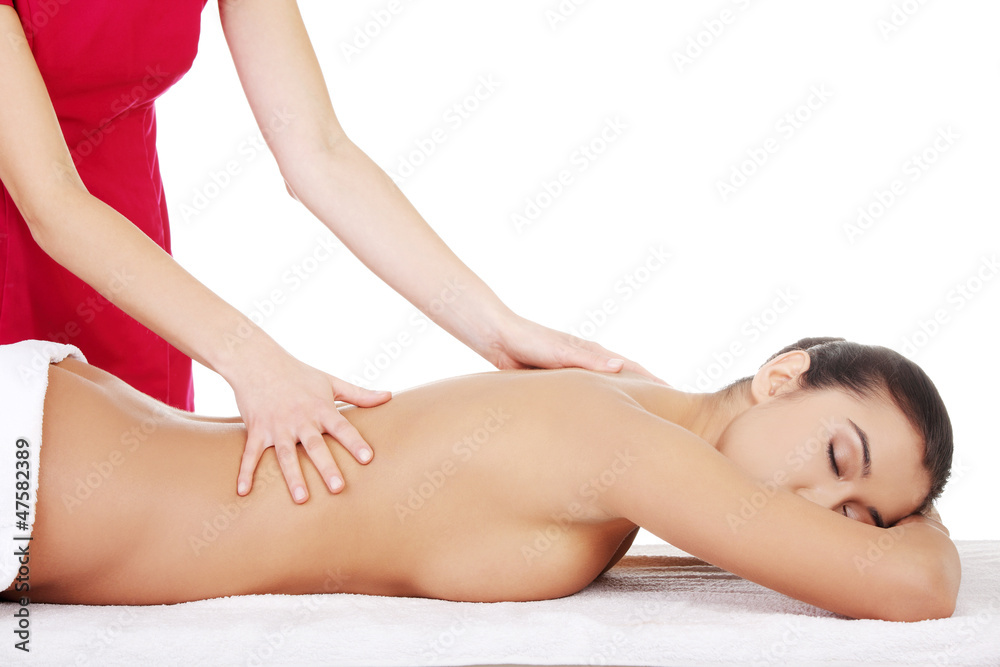 Young woman relaxing beeing massaged